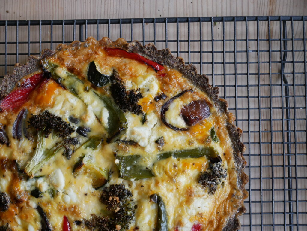 Roasted vegetable quiche with a cheddar crust